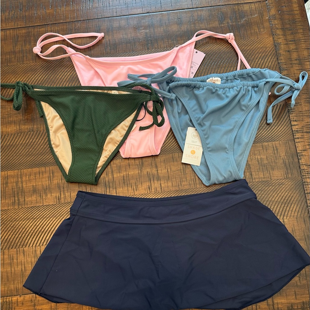 Pink, Green, and Blue string bottoms NWT
Navy skirted bottom does not have tag
